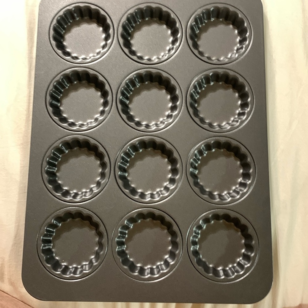This is a tart pan that makes 12 mini tartlets and is made by Chicago metallic